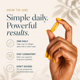 Hand holding a golden softgel capsule alongside daily dosage instructions for BioTonix Bio Omega-3.