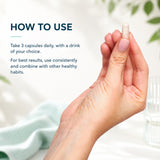 Hand holding a supplement capsule next to directions explaining how to take 3 capsules daily of BioTonix BioBase.