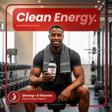 Man sitting in a gym holding a bottle of Naturmade Ginseng Complex for clean natural energy support.
