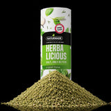 Naturmade Herbalicious original flavor herb salt seasoning canister behind a pile of green herb salt blend