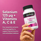 Woman's hand holding a bottle of Naturmade Selenium plus EAC 90 capsules
