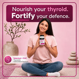 Woman holding Naturmade Selenium plus EAC bottle seated on a yoga mat
